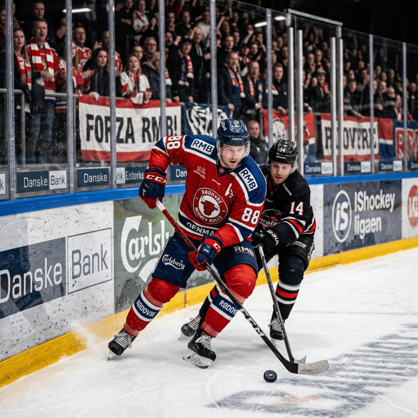 Two ice hockey players battle for the puck near the boards